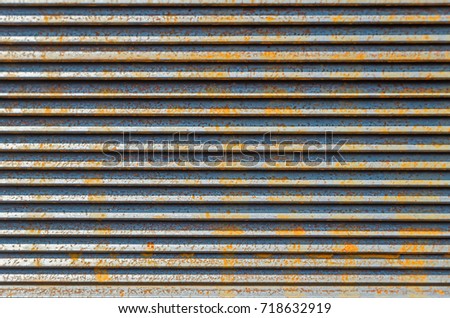 Beginner to rust metal L-bar angle in packs at the warehouse of metal products piled in the open air Stock fotó © 