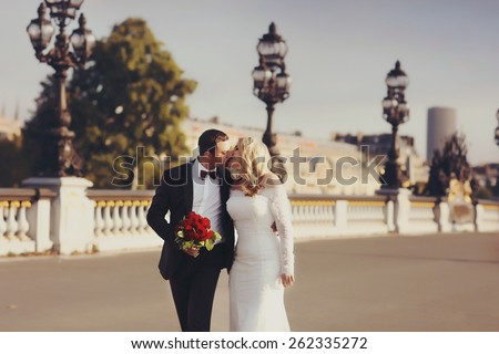 Bride and groom having a romantic moment on their wedding day in Paris
