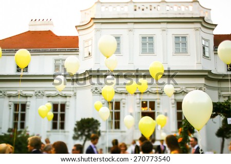 many flying yellow balloons background castle Vienne Austria
