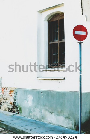 stop sign on a white background wall and windows  city Vilnius Lithuania