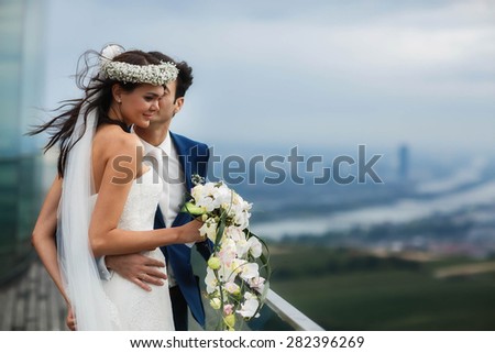 elegant gentle stylish groom and bride on the background amazing landscape