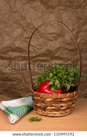 Fresh sweet pepper and parsley in a basket
