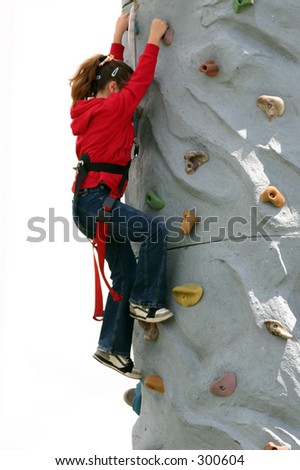 Girl in red climbs the wall at the local Chili cook off