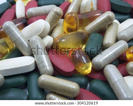 Vitamin,many color vitamin,drug,multivitamin,herbal supplement capsules,fish oil,Natural organic green algae tablets Colorful drugs,pills and tablets,background