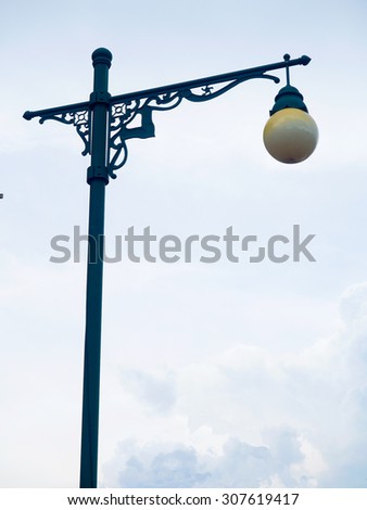 Street lamp iron on cloudy day, street lamp pole