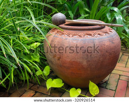 earthen jar in the garden,earthen water jar,garden props,