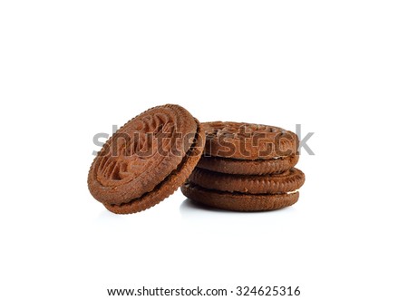 Chocolate cookies with cream filling tower isolated on white background.