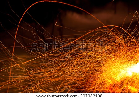 Abstract nature: long exposure photo of fire camp sparkles
