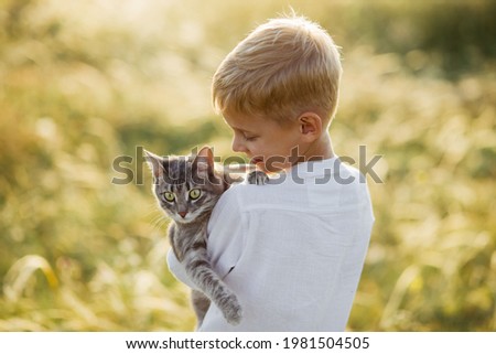 Similar – Image, Stock Photo Little boy and cat taking selfie with mobile phone on bed