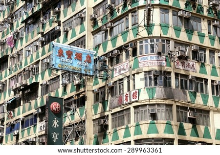 HONG KONG, CHINA - September 14, 2013: Front of a Kowloon Hotel with laundry hanging out.