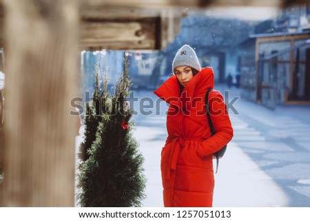 Similar – Image, Stock Photo Traveling woman in outerwear using smartphone in nature