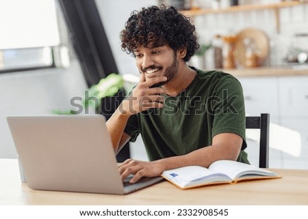 Similar – Image, Stock Photo Smiling curly haired man listening to music in headphones