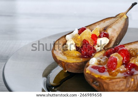 dessert of baked pears with honey and candied fruit