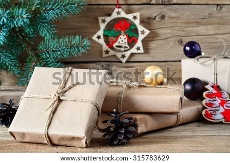 On wooden background closeup of Christmas gifts. Free space for text. Copy space
