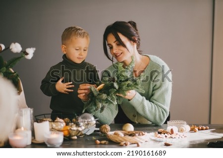 Similar – Image, Stock Photo Woman making Christmas wreath of spruce, step by step. Concept of florist’s work before the Christmas holidays.