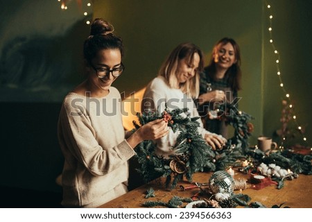 Similar – Image, Stock Photo Woman making Christmas wreath of spruce, step by step. Concept of florist’s work before the Christmas holidays.