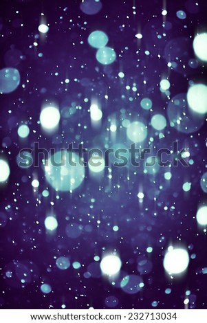 the christmas snowfall in the evening, natural photography of bokeh background