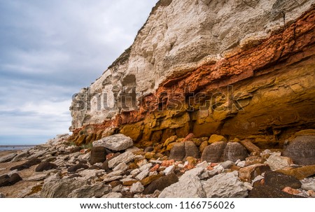 White chalk and red sandstone geological layer cliffs Foto d'archivio © 