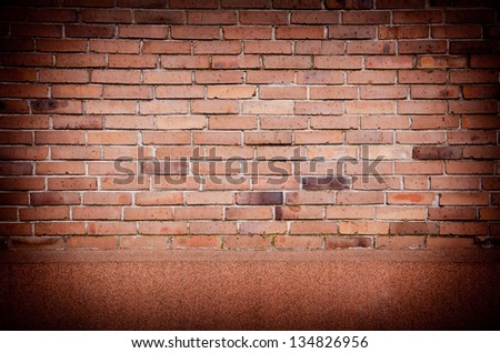 Dark red brick wall abstract with black vignette, bricks wall surface detail background in horizontal orientation, digitally altered, nobody.