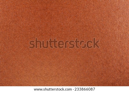 Orange iridescent cardboard texture abstract, paper plain grainy smooth surface background in horizontal orientation, nobody.