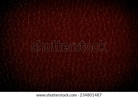 Dark brown leather sheet texture abstract with black vignette, material grunge surface background in horizontal orientation, digitally altered, nobody.