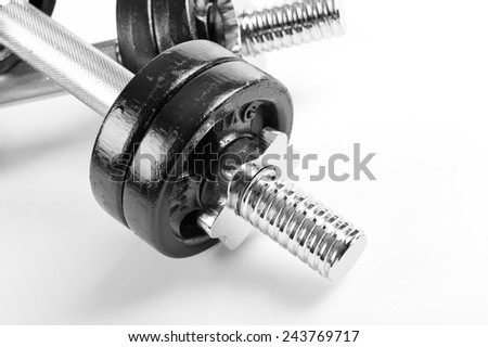 Chrome screw on hand barbells weights black color on white background in horizontal orientation, nobody.