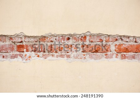 Red bricks broken wall unveil texture background, brick wall surface detail abstract in horizontal orientation, nobody.