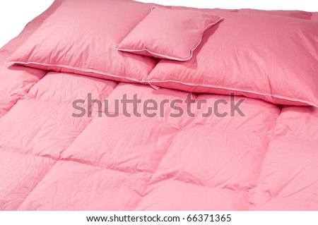Cotton pink fluff pillows on duvet without cover, eiderdown filled with fluff or feathers. Horizontal orientation, nobody.