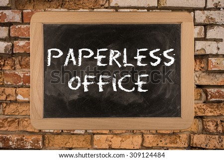 Paperless office on Blackboard. Paperless office on Blackboard on bricks wall