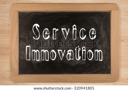 Service Innovation -  chalkboard with  outlined text - on wood