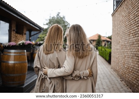 Similar – Image, Stock Photo Rear view blonde woman walking in the evening on field, low sun