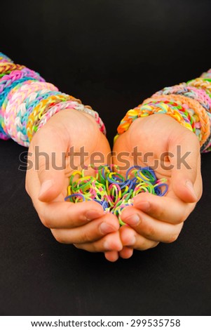 Colorful rubber bracelets on your wrist.