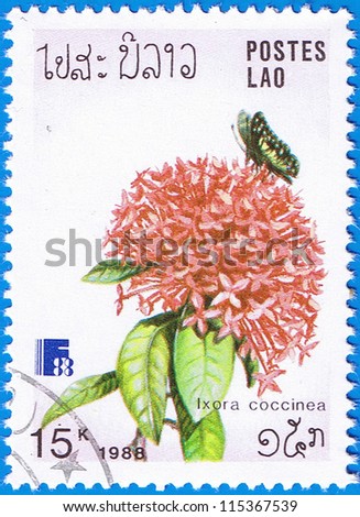 LAOS - CIRCA 1988: A stamp printed in Laos shows jungle geranium, series is devoted to flowers, circa 1988