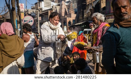 VARANASI, INDIA - FEB 19, 2012: Many charity organizations give food offerings to poor people at Mahashivaratri religious ceremony festival on February 19, 2012 in Varanasi, India.