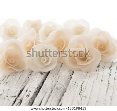 decorative roses on the white table with place for the text