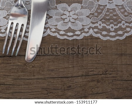 utensils on the wooden background with place for the text