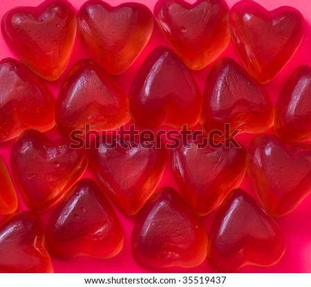 sweet and soft rubber hearts on red background