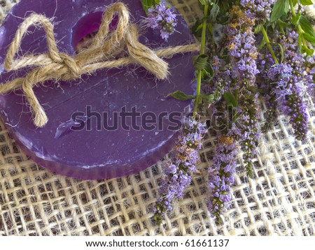purple soap with string with mint flowers, aromatic therapy