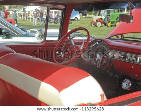 MARION, WI - SEPTEMBER 16: Interior passenger view of Red & White 1955 Chevy Bel Air car at the 3rd Annual Not Just Another Car Show on September 16, 2012 in Marion, Wisconsin.