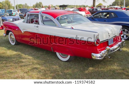 MARION, WI - SEPTEMBER 16: Side view of 1955 Red & White Ford Crown Victoria Fairlane Fordomatic car at the 3rd Annual Not Just Another Car Show on September 16, 2012 in Marion, Wisconsin.