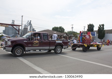SEYMOUR, WI - AUGUST 4:  Side view of Truck pulling Hardees Float with Star and Spider Man at the Annual Hamburger Festival Parade on August 4, 2012 in Seymour, Wisconsin.