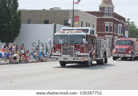 SEYMOUR, WI - AUGUST 4:  Pulaski Fire Department Engine Truck at the Annual Hamburger Festival Parade on August 4, 2012 in Seymour, Wisconsin.