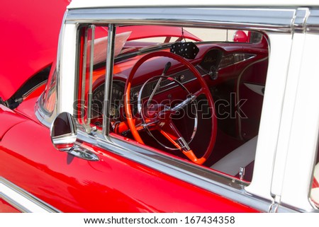 WAUPACA, WI - AUGUST 24:  Interior of a red and white1956 Chevy Bel Air car at Waupaca Rod and Classic Annual Car Show August 24, 2013 in Waupaca, Wisconsin.