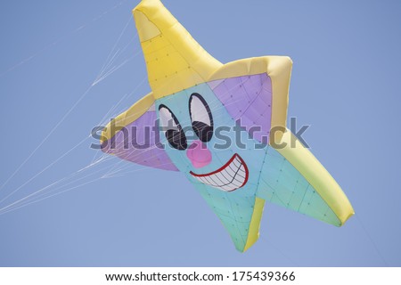 OSHKOSH, WI - JUNE 20:  Close up of a colorful custom star kite fly high in the sky at the Kite Festival June 20, 2009 in Oshkosh, Wisconsin.