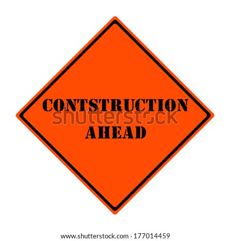 An orange and black diamond shaped road sign with the words CONSTRUCTION AHEAD making a great concept.