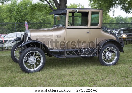 IOLA, WI - JULY 12:  Gold 1927 Ford Model T Car at Iola 42nd Annual Car Show July 12, 2014 in Iola, Wisconsin.