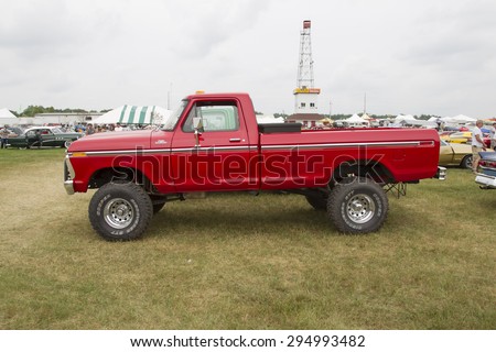 IOLA, WI - JULY 12:  Side of 1977 Red Ford F150 Pickup Truck at Iola 42nd Annual Car Show July 12, 2014 in Iola, Wisconsin.