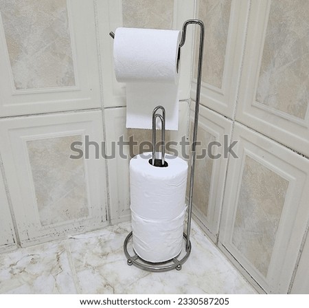 Similar – Foto Bild Ersatzrolle Toilettenpapier an der Wand hängend in einer öffentlichen Toilette