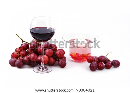 Still life on a white background glass of red wine, grapes and a candle in a decorative candlestick. wine, red, still life, glass, white, background, beautiful, romantic, grapes, candle