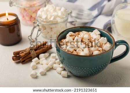 Similar – Image, Stock Photo A cup of cocoa with gingerbread cookies and a candy cane on a white table